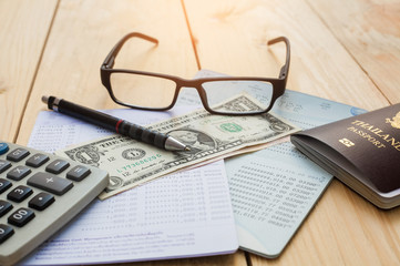 Bank account Pen,dollar,glasses ,coffee cup and calculator with