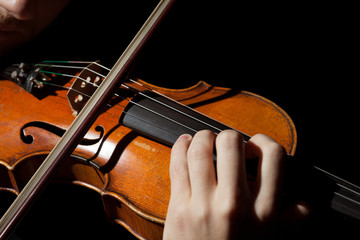 Close-up photo of man playing violin