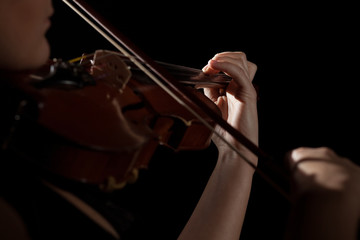 Close-up photo of woman playing violin
