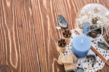 spa stuff on wooden background: candle, aroma