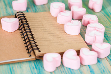 recycle note book and pen with sweet heart shape on