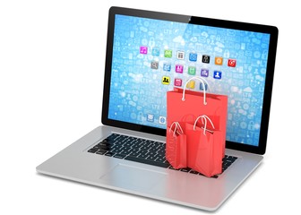 laptop and  shopping pags on white background