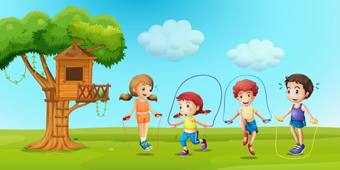 Children skipping rope in the park