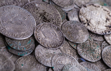 trove of ancient medieval coins silver background
