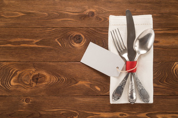 Vintage cutlery on wooden table 