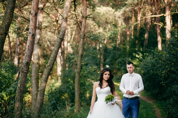 Wedding shot of bride and groom in park