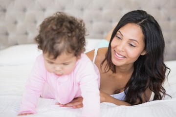 Brunette playing with her baby