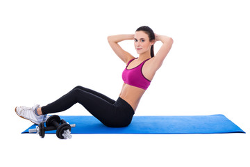 slim woman doing exercises for abdominal muscles isolated on whi