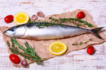 ingredients for baking scomber fillets, include raw mackerel, lemon, garlic, rosemary