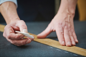 Tailor hands with chalk