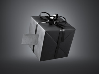 Black gift box with black ribbon bow and blank business card, isolated on dark, soft shadows.  3d render