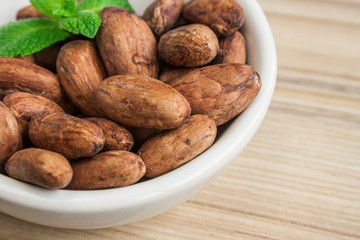 Close up image of cocoa beans in a bowl.