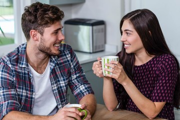 Happy couple having coffee together