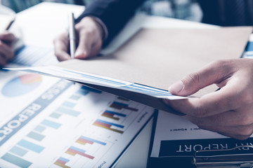 Business adviser analyzing financial figures denoting the progre