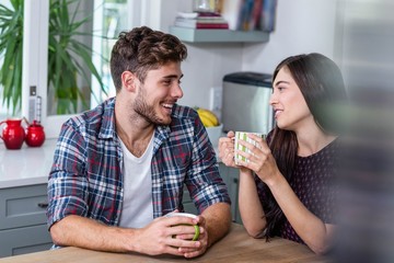 Happy couple having coffee together
