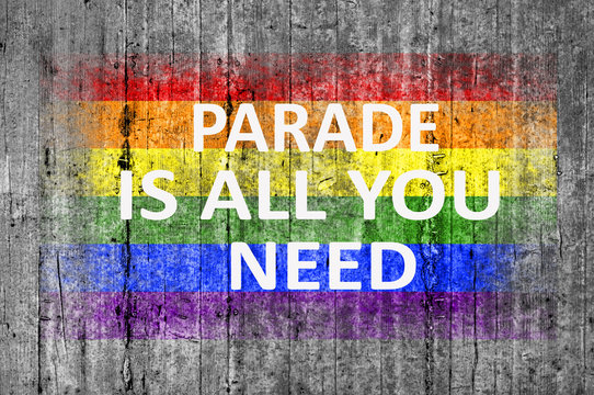 Parade is all you need and LGBT flag painted on background textu