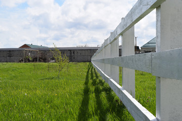 White wooden fence around the ranch