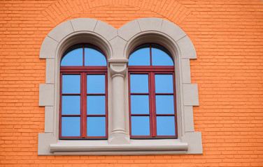 orange wall and green wood windows