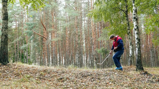 Protection of the environment and ecology.  Dosimetrist radioactivity was measured using a device -  dosimeter in the green sunny forest. Radiation Measurement. Atomic nuclear energy.