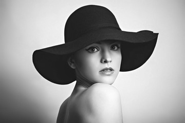 Black white portrait of woman in black hat 