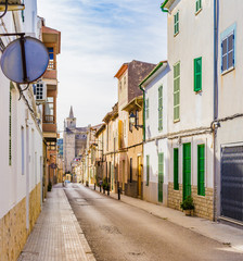 View of an narrow street with mediterranean buildings
