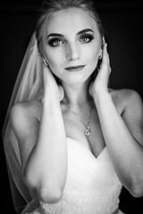 Beautiful innocent blonde bride posing, face closeup b&w