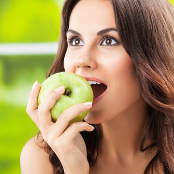  smiling woman with apple