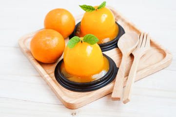 Orange cake on wooden background