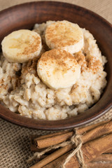 Oatmeal with banana sprinkled ground cinnamon