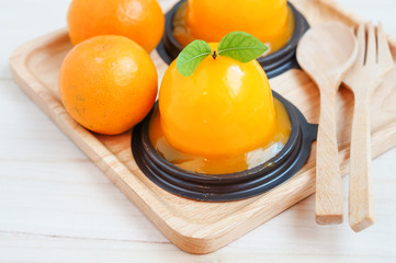 Orange cake on wooden background