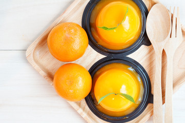 Orange cake on wooden background