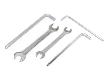 Different sized chrome wrenches isolated on white, top view