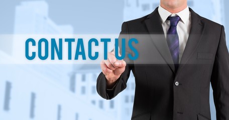 Contact us against low angle view of city buildings