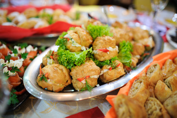 Cattering. Table full of food at a restaurant.