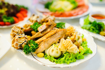 Cattering. Table full of food at a restaurant.