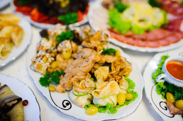 Cattering. Table full of food at a restaurant.