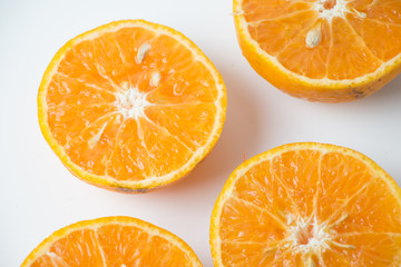 Oranges fruit, half of orange, orange isolated and basket with a lot of oranges