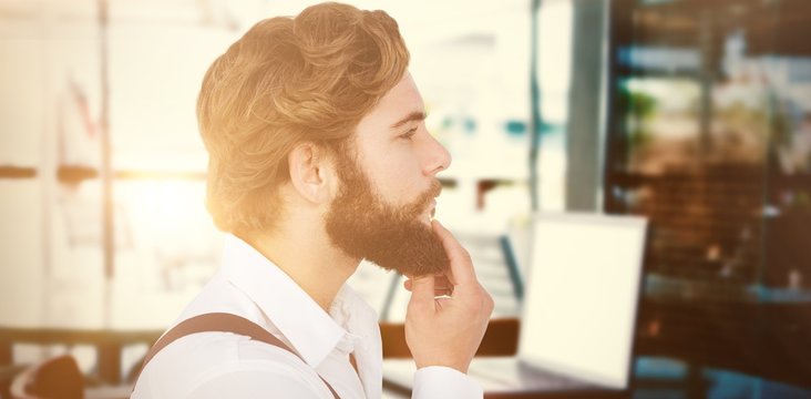 Composite image of profile view of hipster touching beard