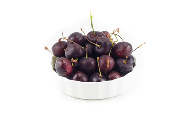 Fresh dark purple cherry isolated white background