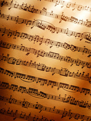 Sheet of musical notes with warm lighting