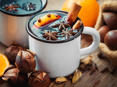Mulled wine in mugs and roasted chestnuts