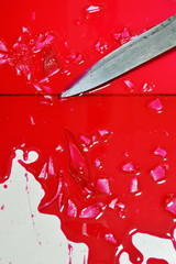 knife and lot of blood on tile floor