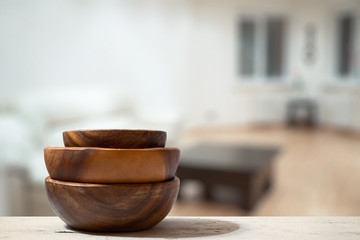 stack of empty wooden bowls on table