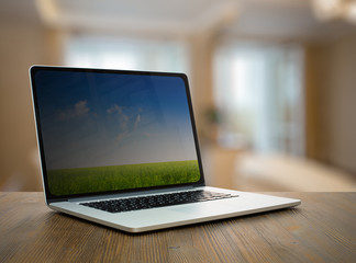 Fototapeta premium computer on wooden table in room