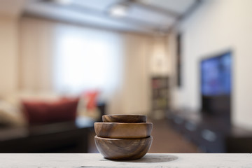 stack of empty wooden bowls on table