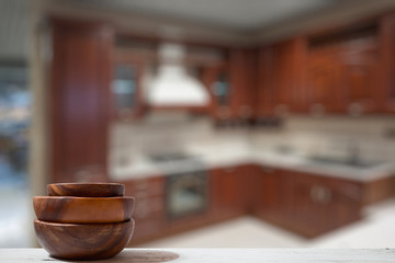 stack of empty wooden bowls on table