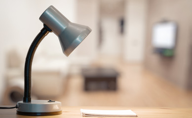 lamp and notebook on table