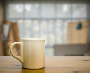 Fototapeta na wymiar mug on old wooden table