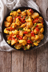 Gobi Aloo with cauliflower and vegetables vertical top view © FomaA