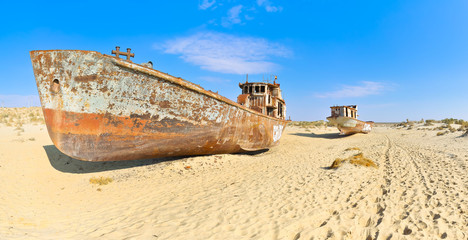 Panorama. Two old ship in the Aral desert